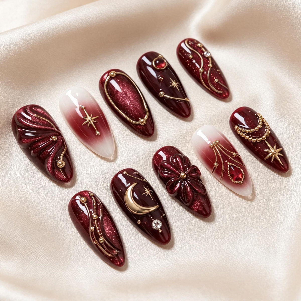 Burgundy Celestial Nail Set with Gold Moons, Starbursts, and Sculpted Flowers
