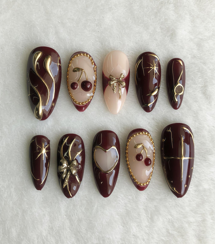 Burgundy Cherry Press-On Nails with Gold Linework, Bow, Heart and Beaded Accents