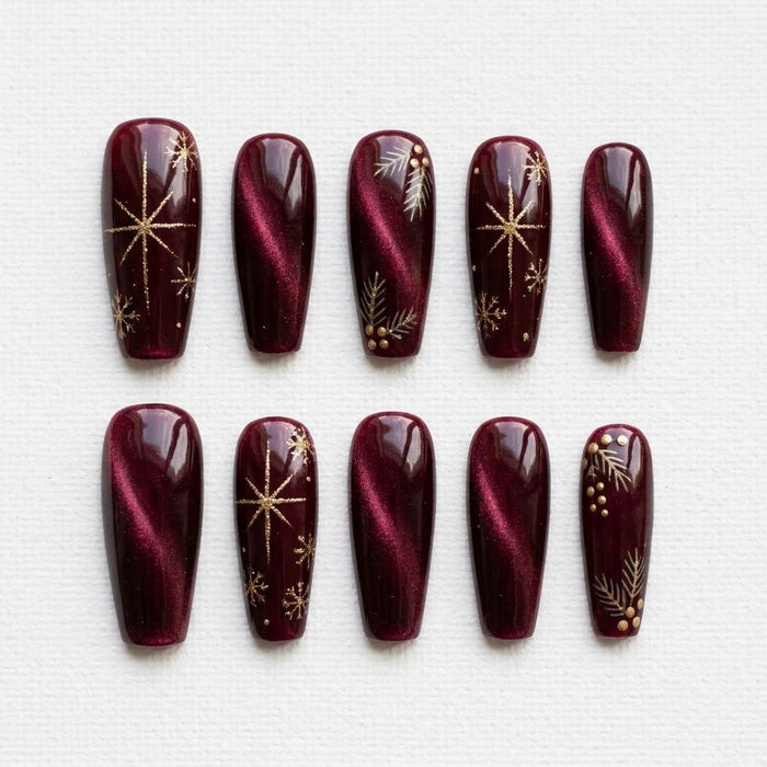 Burgundy Christmas Cat Eye Press On Nails With Gold Starbursts and Botanical Details