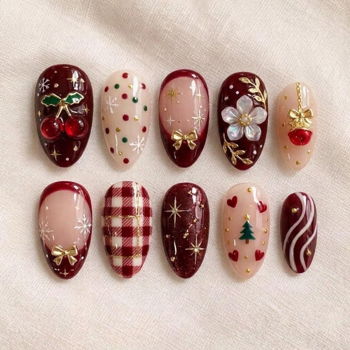 Burgundy Christmas Nails With Plaid, Cherries, Bows, and Gold Details