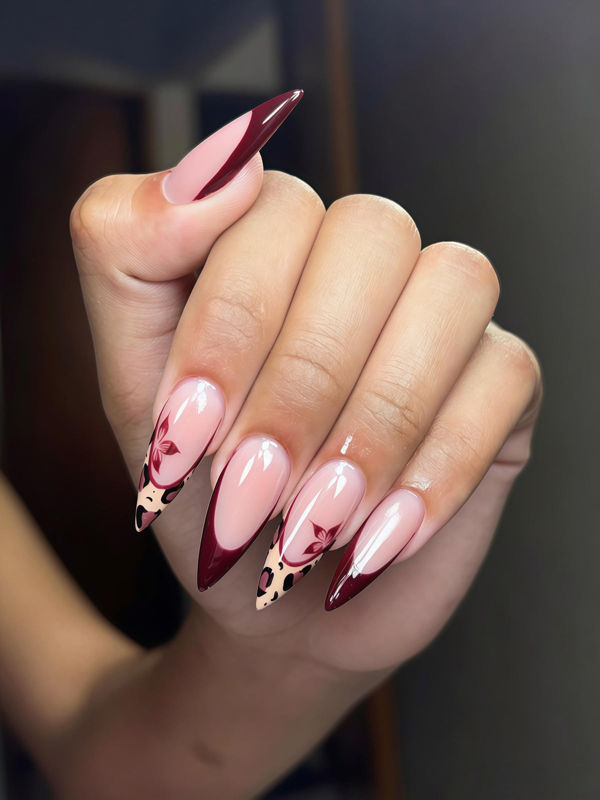 Burgundy French Tip Nails With Leopard Print and Butterfly Motifs