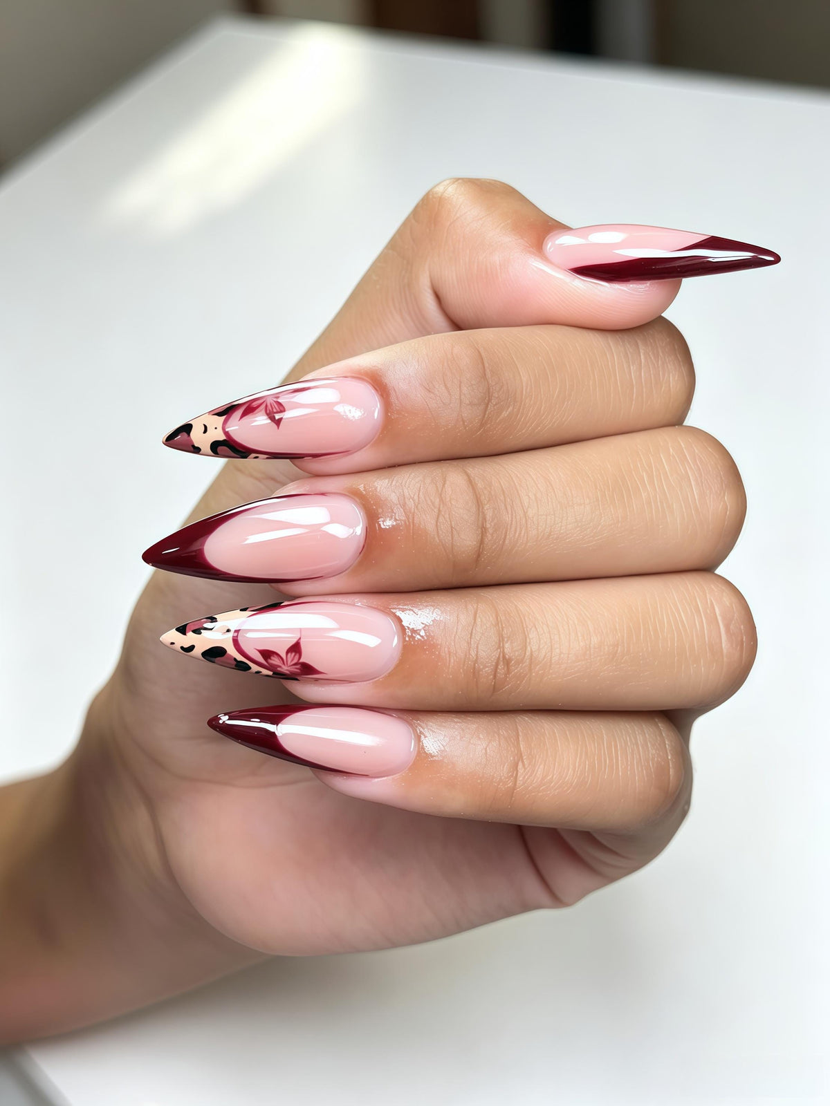 Burgundy French Tip Nails With Leopard Print and Butterfly Motifs
