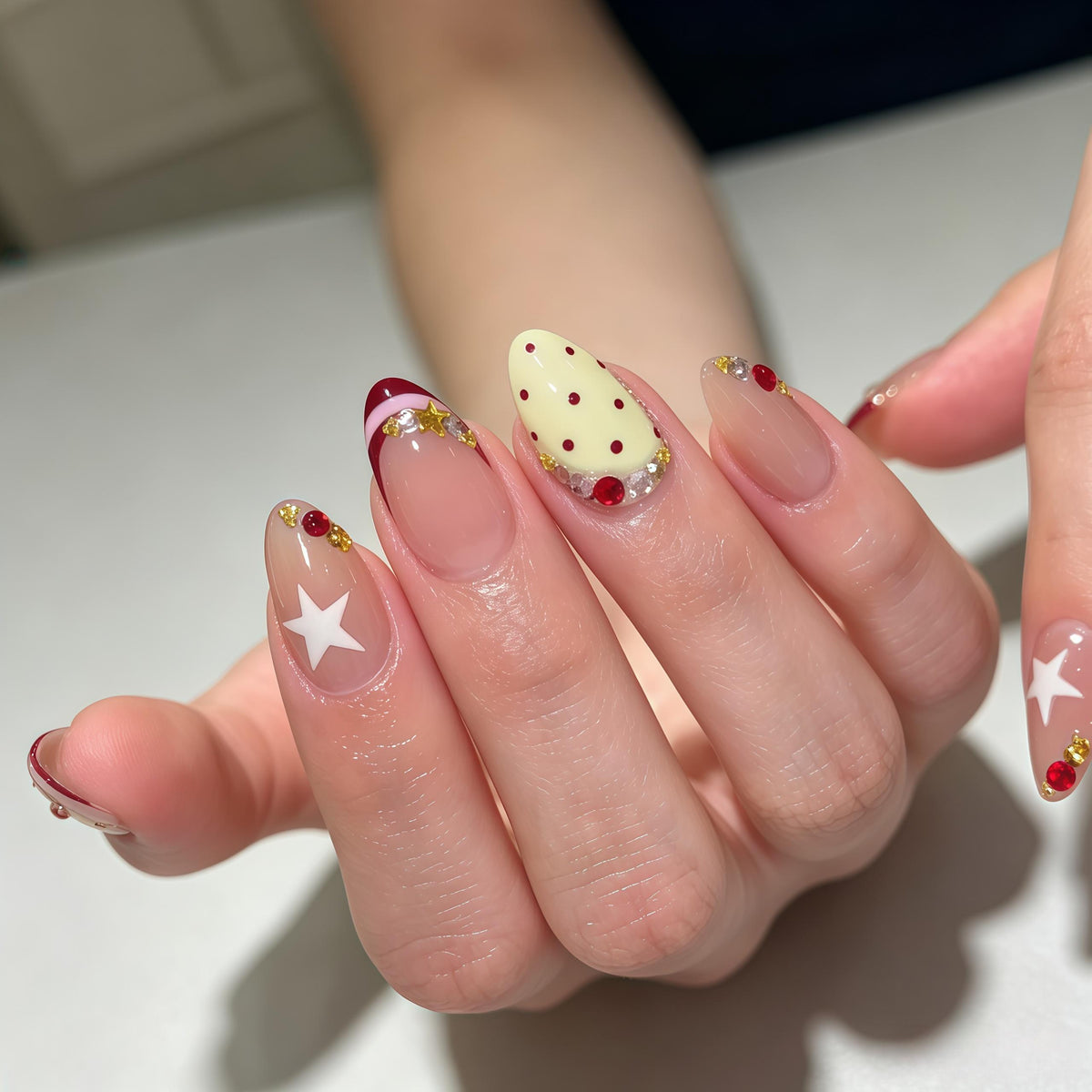 Burgundy Polka Dot French Tip Nail Set with Stars and Gold Accents