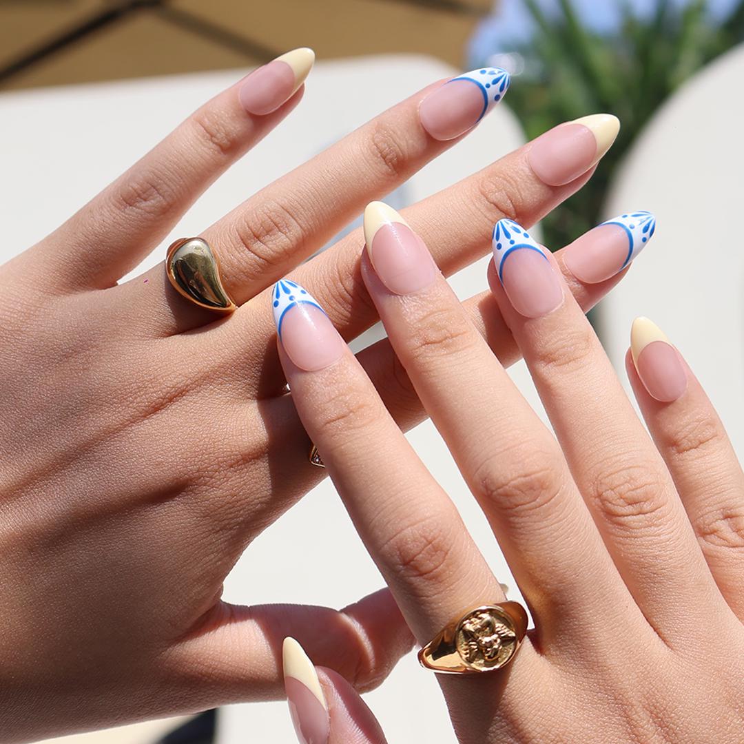 Butter Yellow French Tip Nails With Blue-Edged White Tips and Leaf Details