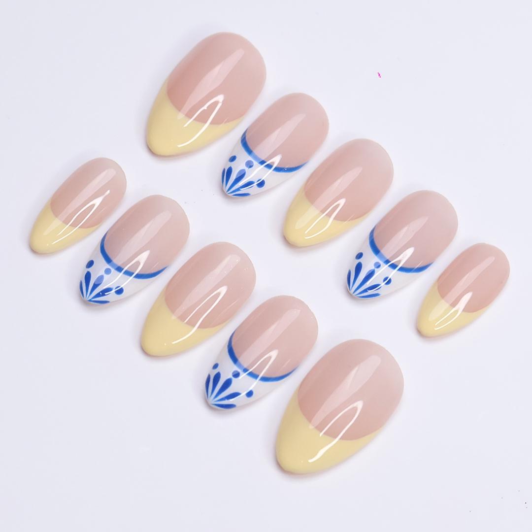 Butter Yellow French Tip Nails With Blue-Edged White Tips and Leaf Details