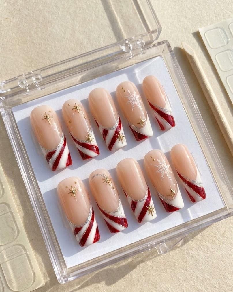 Candy Cane Stripe Christmas Nails with Silver Glitter and Gold Starbursts