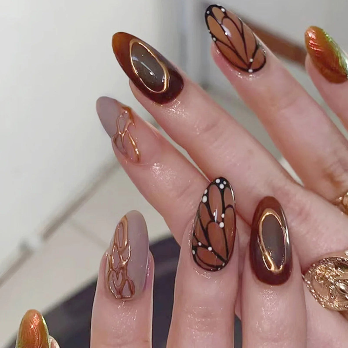 Caramel and Brown Butterfly Nails with Gold Oval Accents