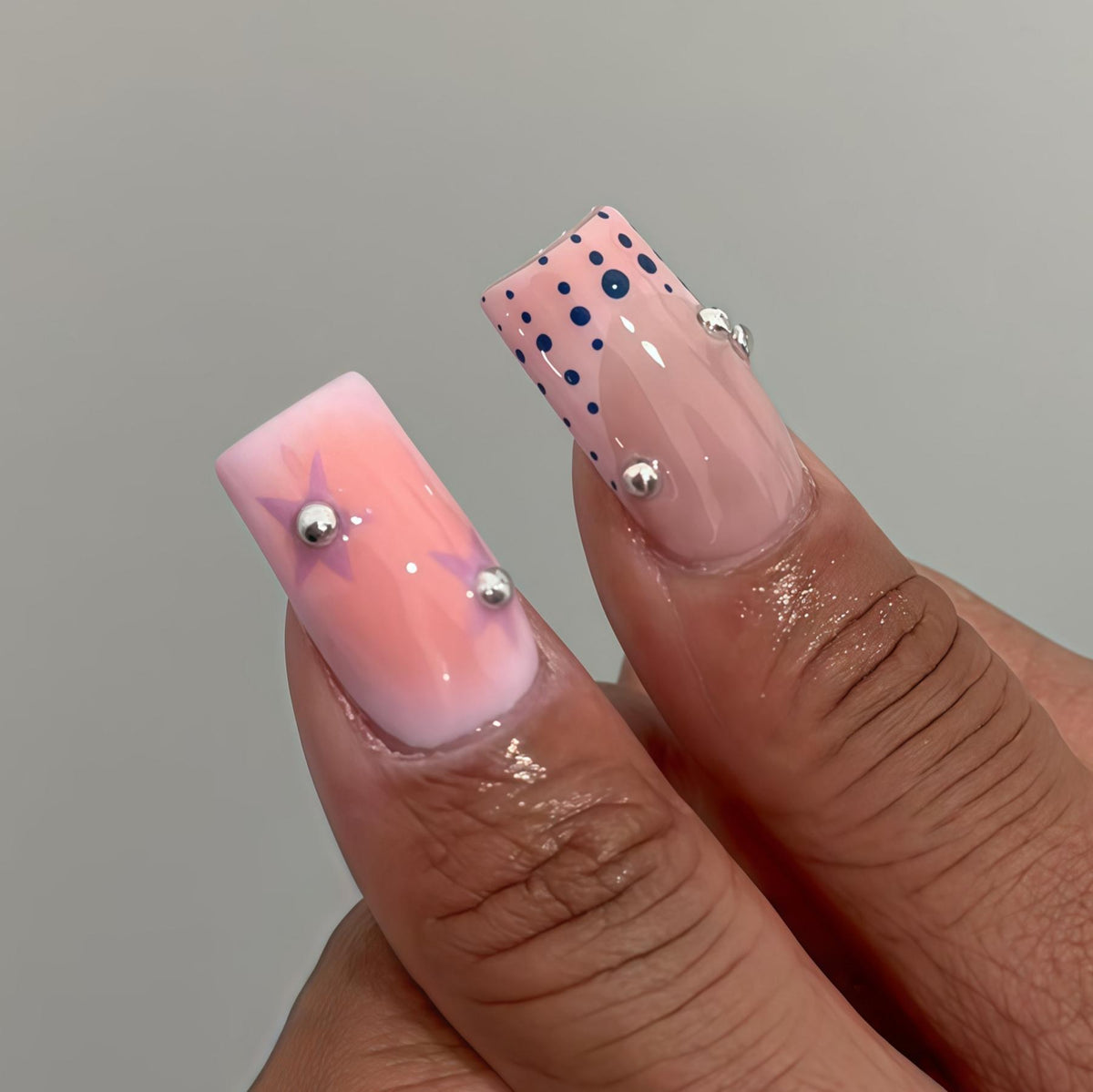 Cartoon Eye Nails with Red Stars, Pastel Pink and Yellow Accents, Silver-Toned Beads