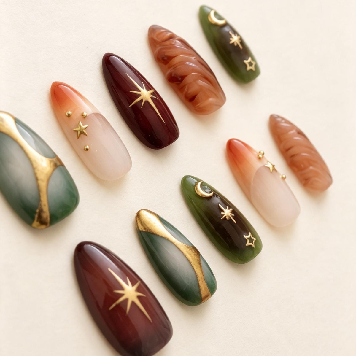 Celestial Emerald and Burgundy Nails with Gold Foil and Sculpted Details