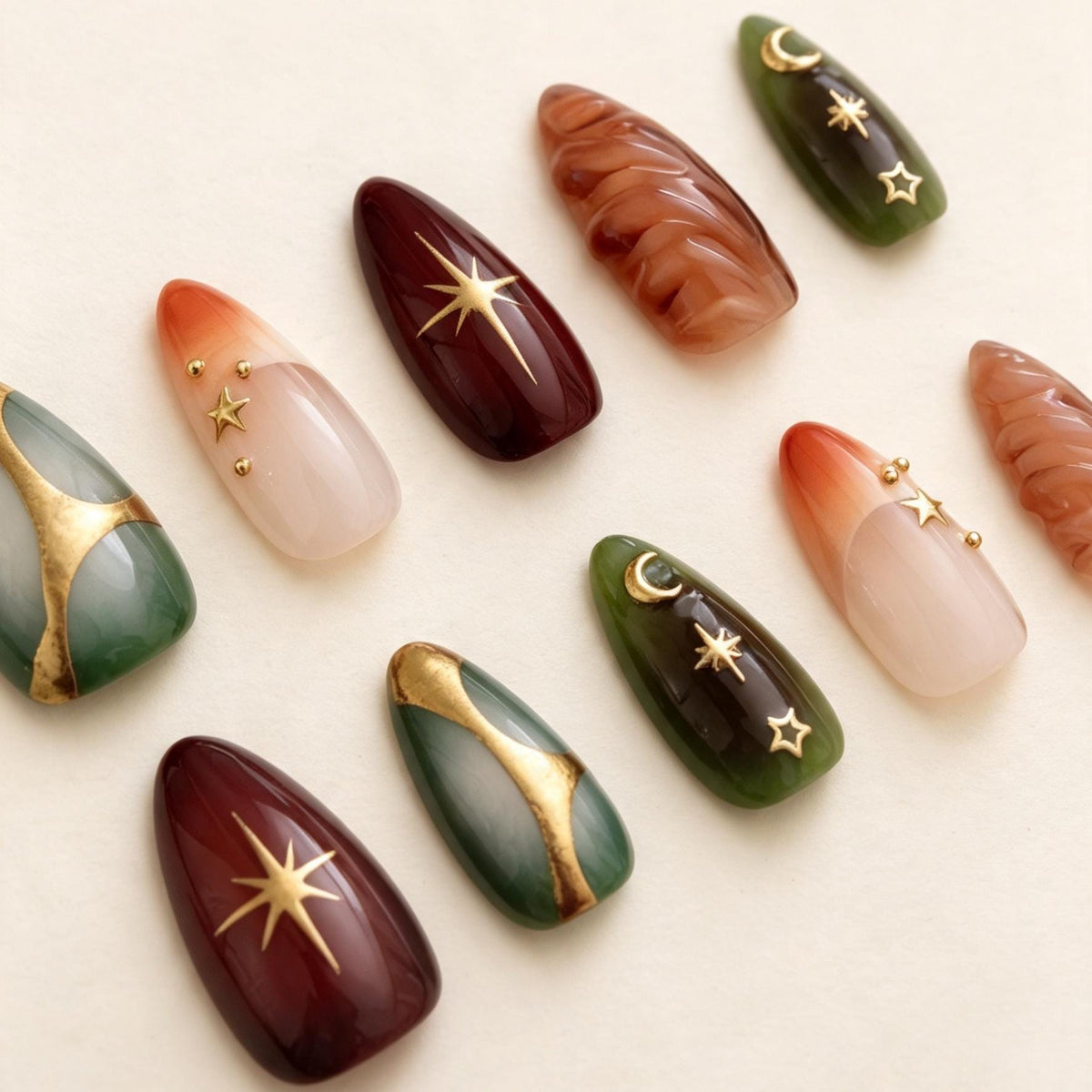 Celestial Emerald and Burgundy Nails with Gold Foil and Sculpted Details