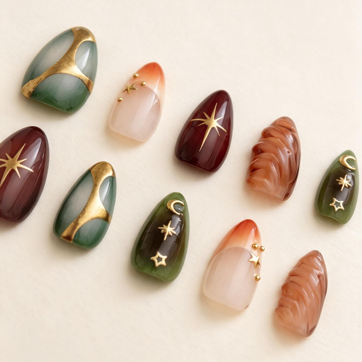 Celestial Emerald and Burgundy Nails with Gold Foil and Sculpted Details