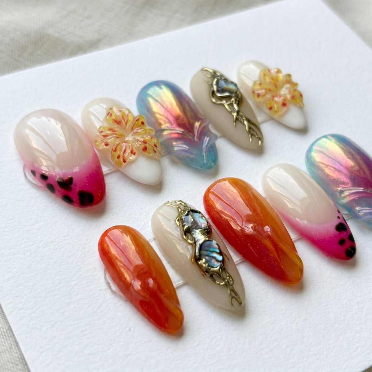 Chrome Aura Flower Press On Nails With Iridescent Accents and Blue Stones