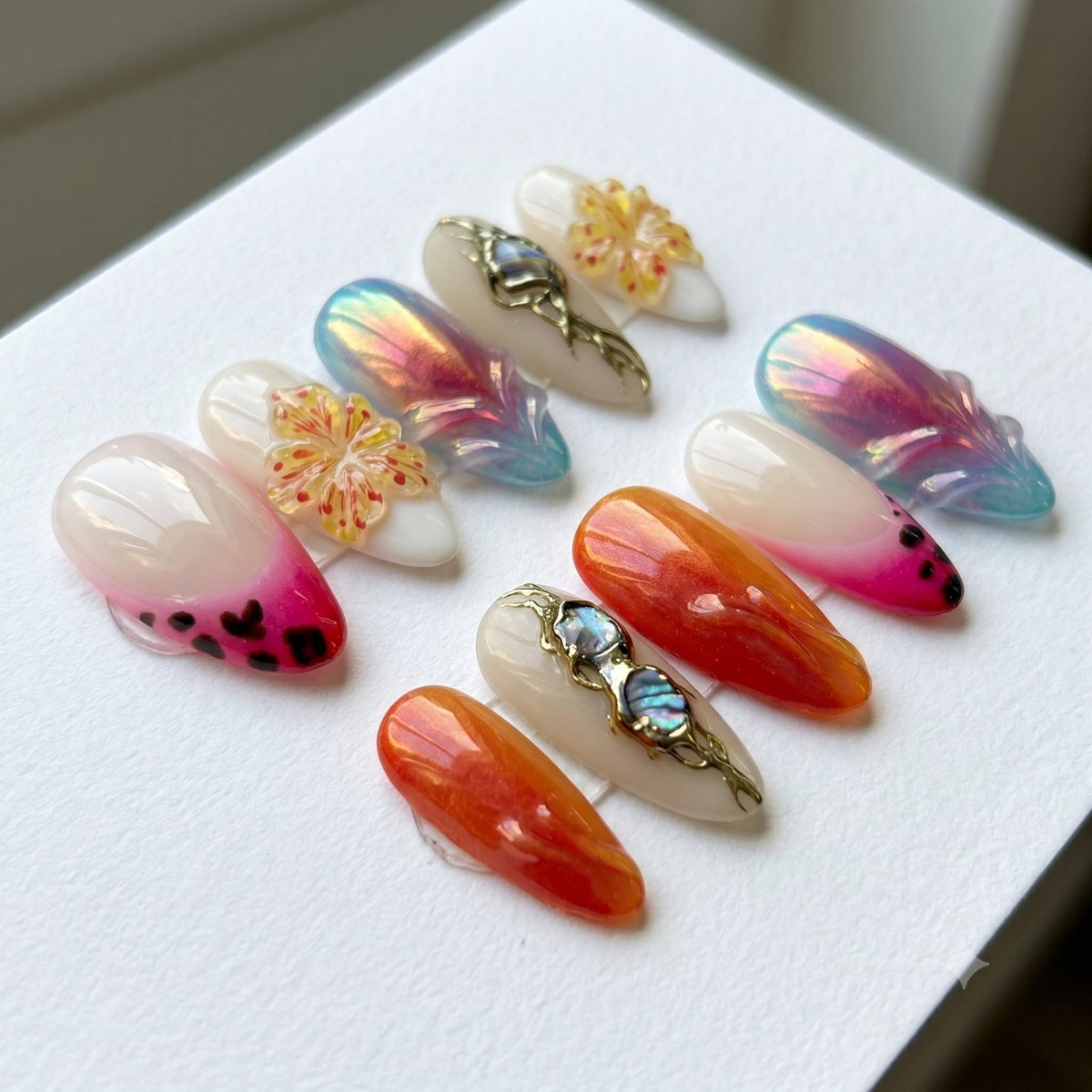 Chrome Aura Flower Press On Nails With Iridescent Accents and Blue Stones