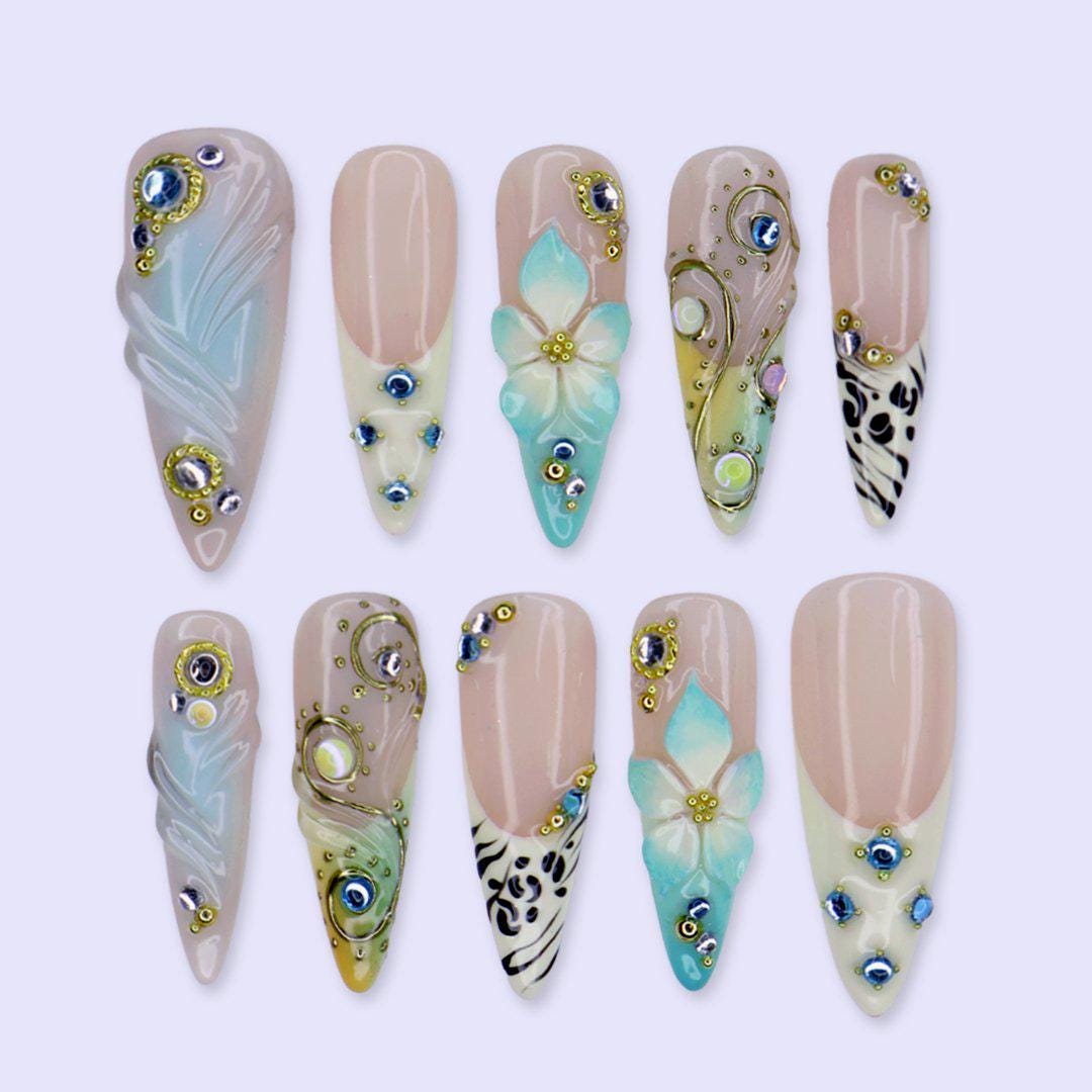 Coastal Summer Aqua Floral Nails with Gold Chrome Swirls, Zebra Tips and Blue Rhinestones