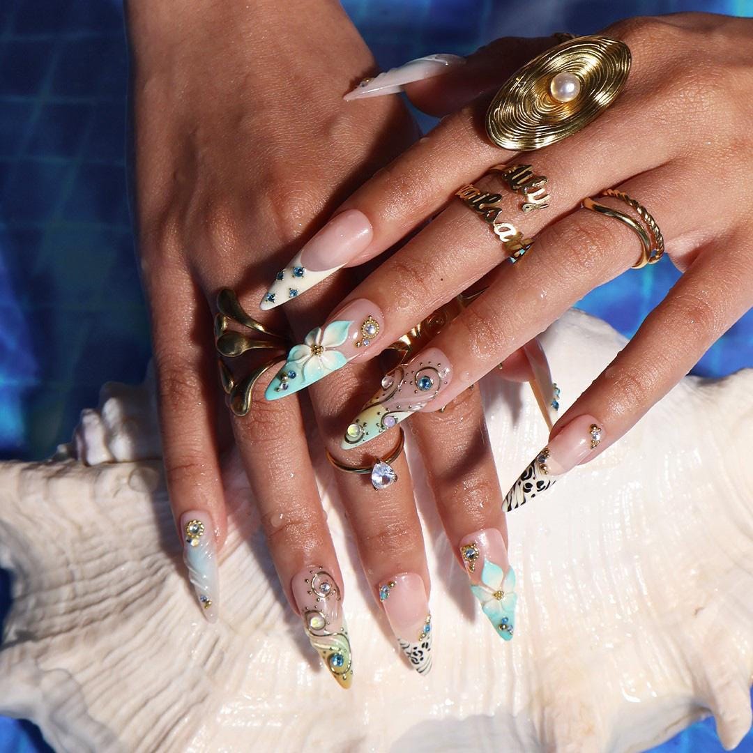 Coastal Summer Aqua Floral Nails with Gold Chrome Swirls, Zebra Tips and Blue Rhinestones