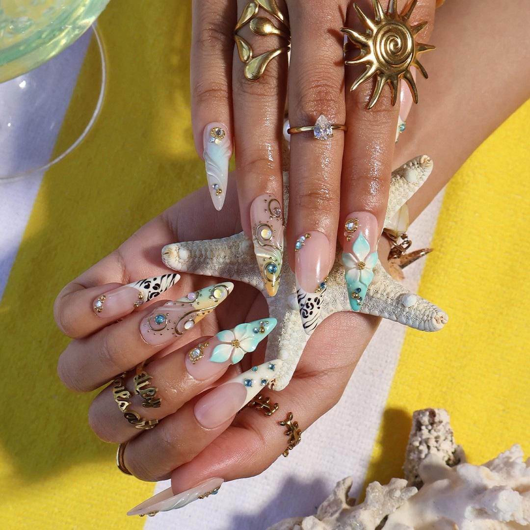 Coastal Summer Aqua Floral Nails with Gold Chrome Swirls, Zebra Tips and Blue Rhinestones