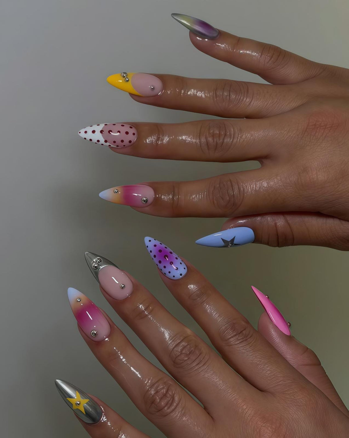 Colorful Pink and Purple Dotted Nails with Metallic Stars and Rhinestones