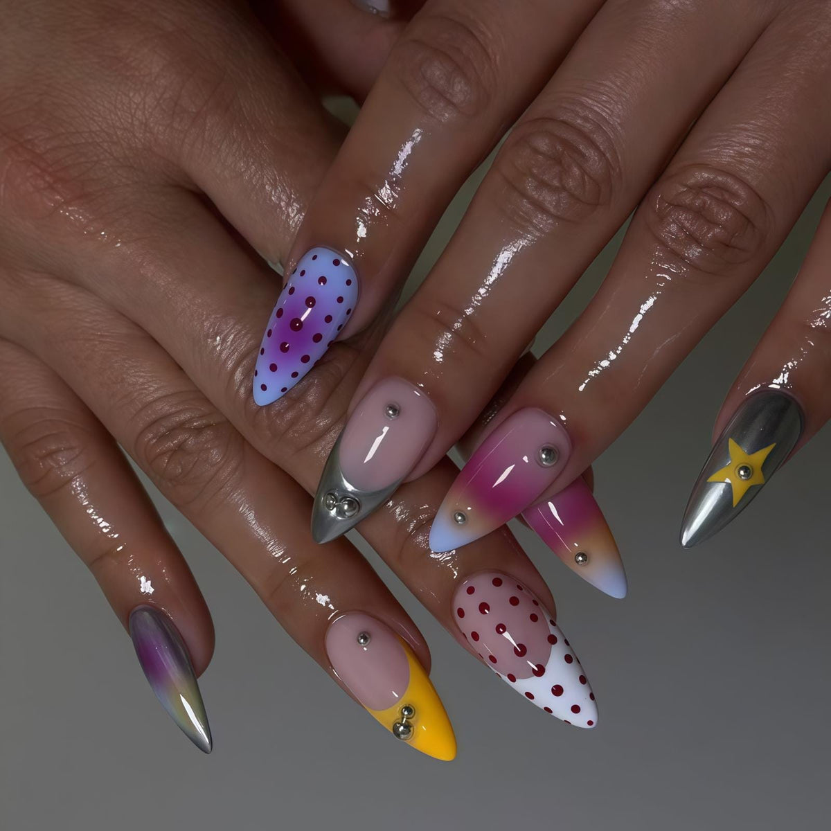 Colorful Pink and Purple Dotted Nails with Metallic Stars and Rhinestones