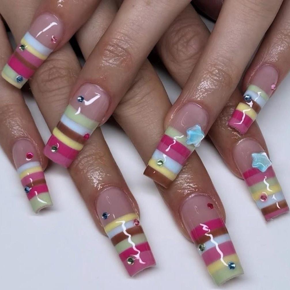 Colorful Striped French Tip Press-On Nails With Rhinestones and Blue Starburst Accents