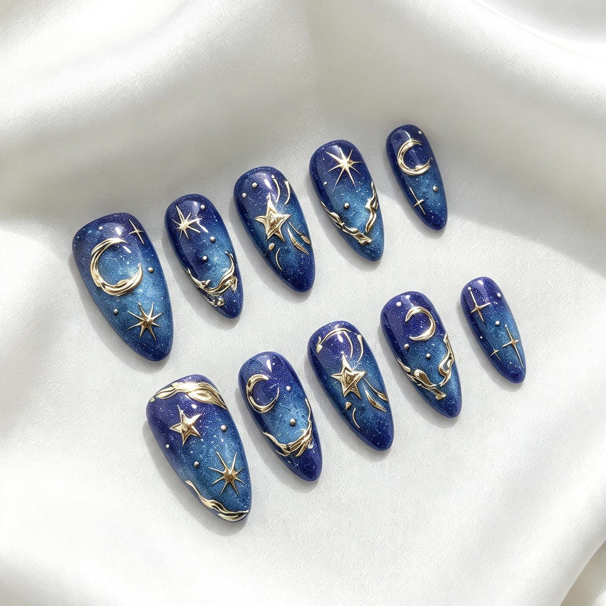 Deep Blue Celestial Press-On Nails With Gold Moons, Stars, and Shimmer