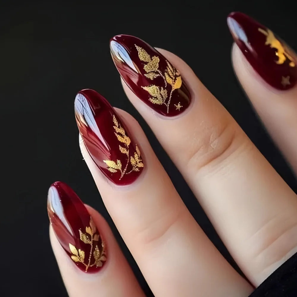 Deep Wine Red Nails With Gold Leaf Branches and Flake Accents