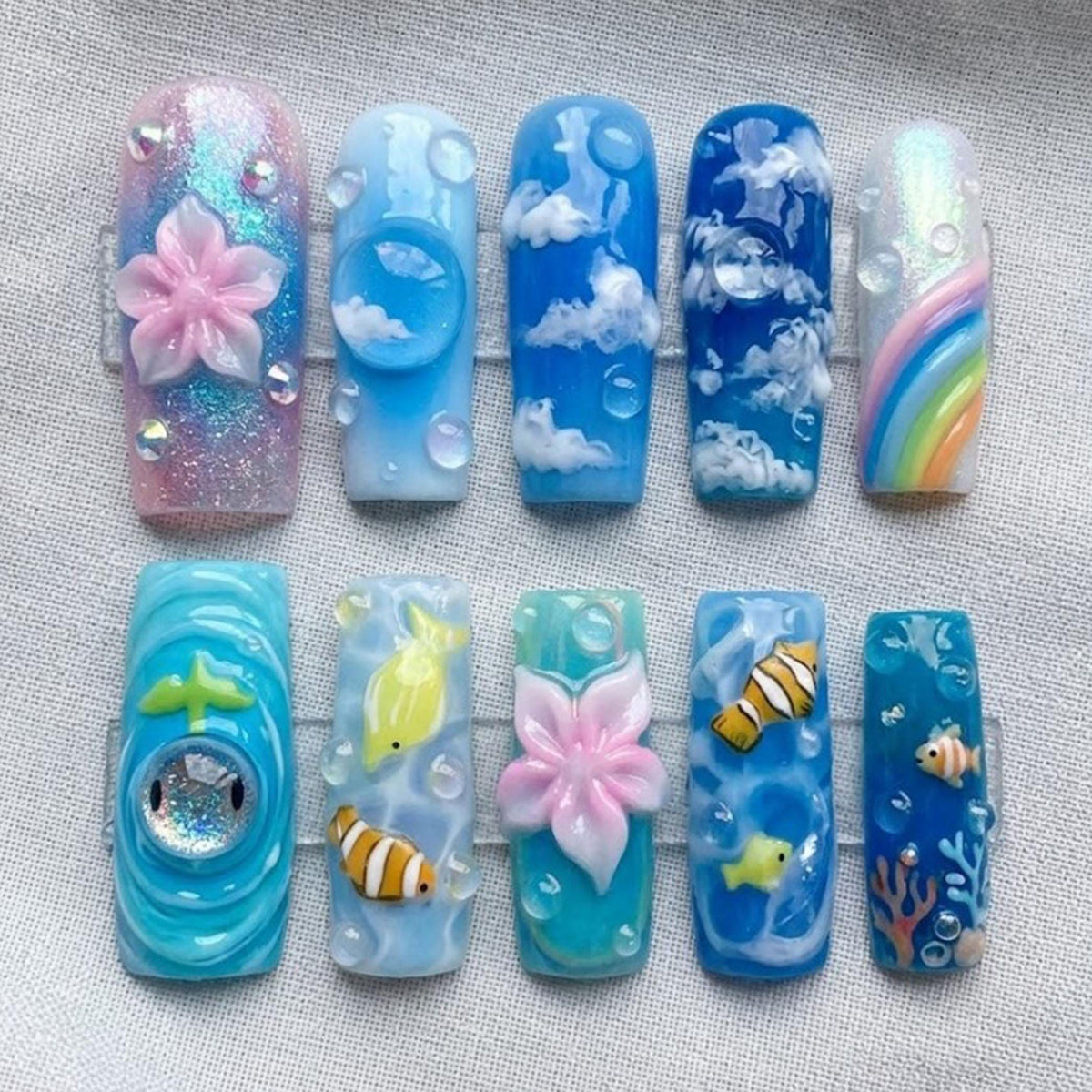 Dreamy Ocean and Sky Nail Set with Clouds, Rainbows, Clownfish, and Flowers