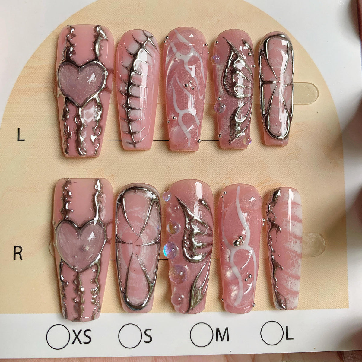 Dusty Pink Marble Press On Nails With Silver Chrome Hearts, Wings and Rhinestones