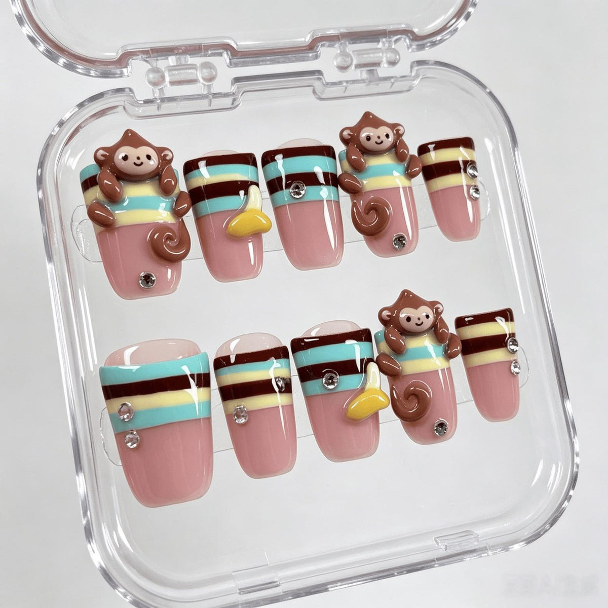 Dusty Pink Monkey and Banana Nails with Colorful Stripes and Rhinestones