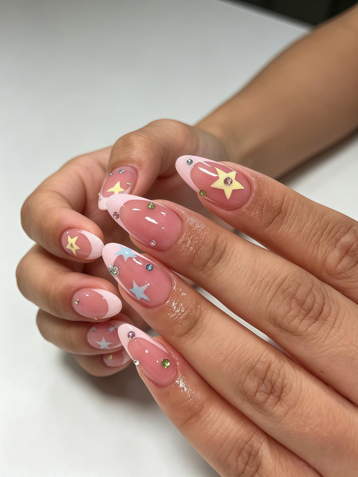 Dusty Rose French Tip Nails With Colorful Stars and Rhinestones