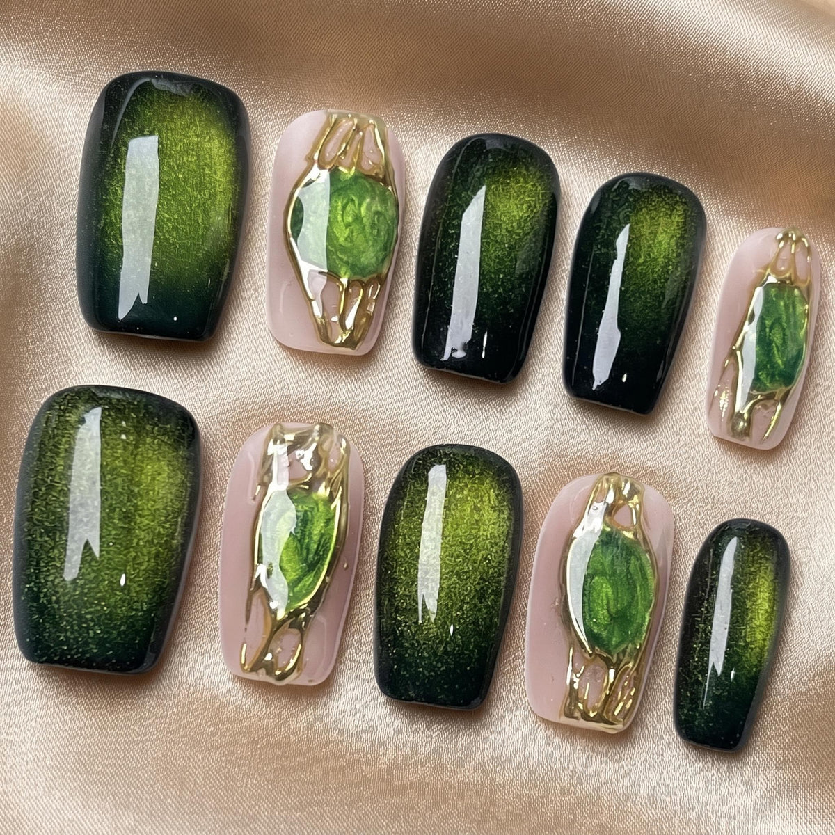 Emerald Green Cat Eye Nails With Gemstone Accents and Gold Frames