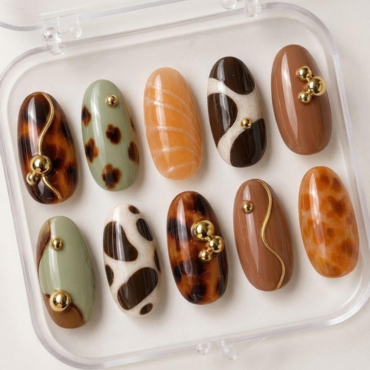 Fall Tortoiseshell and Cow Print Nails in Brown, Sage, Caramel, and Gold
