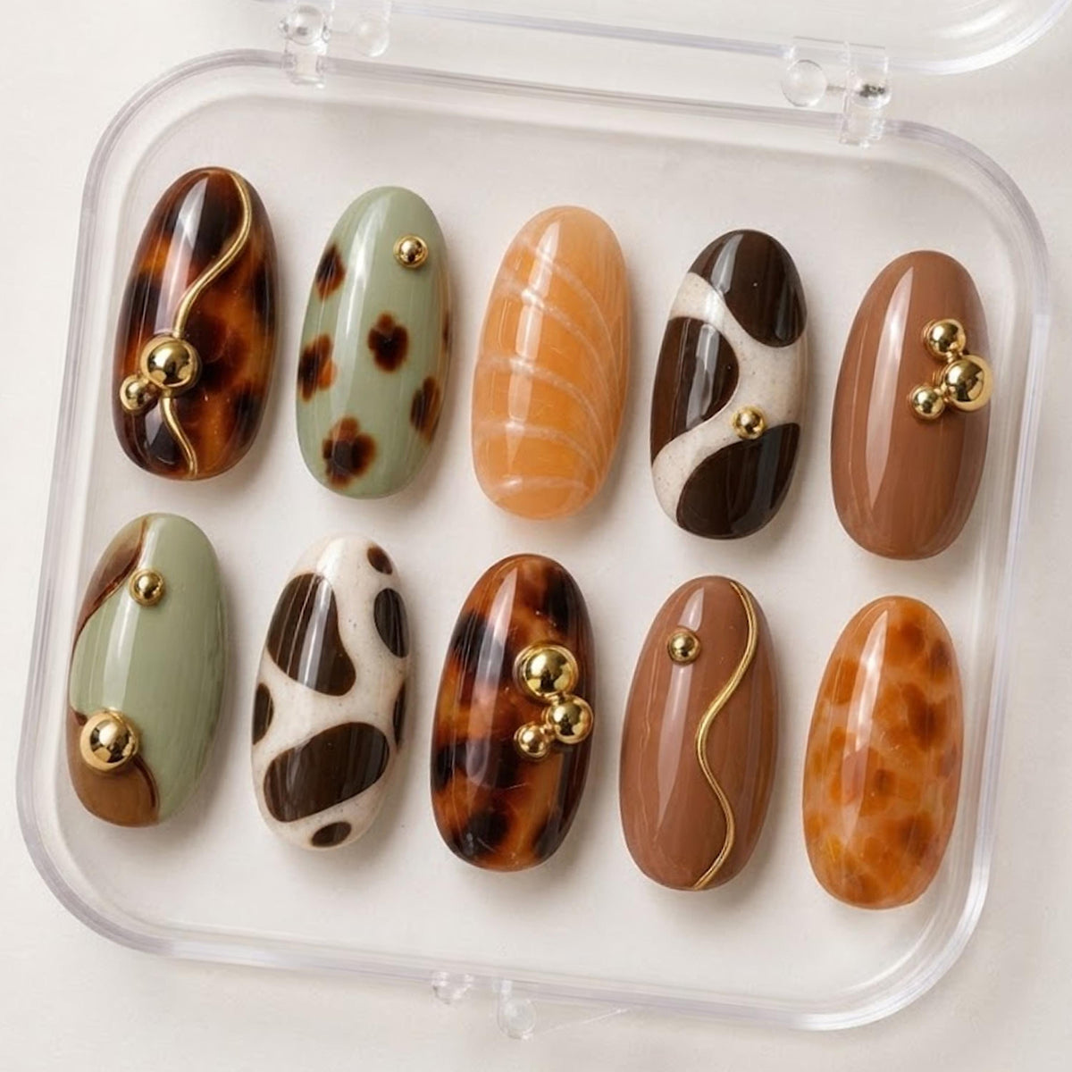 Fall Tortoiseshell and Cow Print Nails in Brown, Sage, Caramel, and Gold