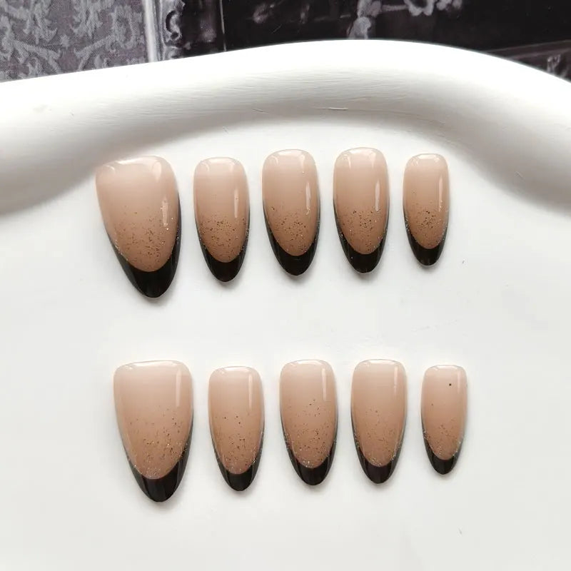 Glossy Nude Nails with Speckled Black French Tips