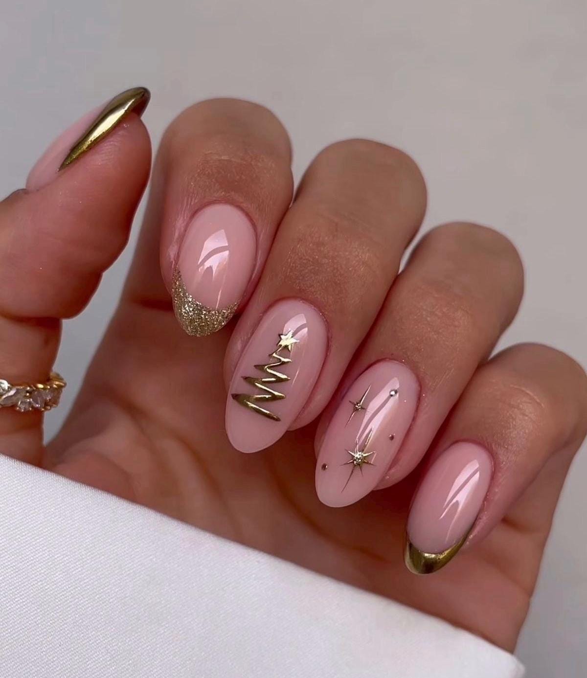 Golden Christmas Press On Nails With Pink Nude Base, Gold Tips and Starburst Details