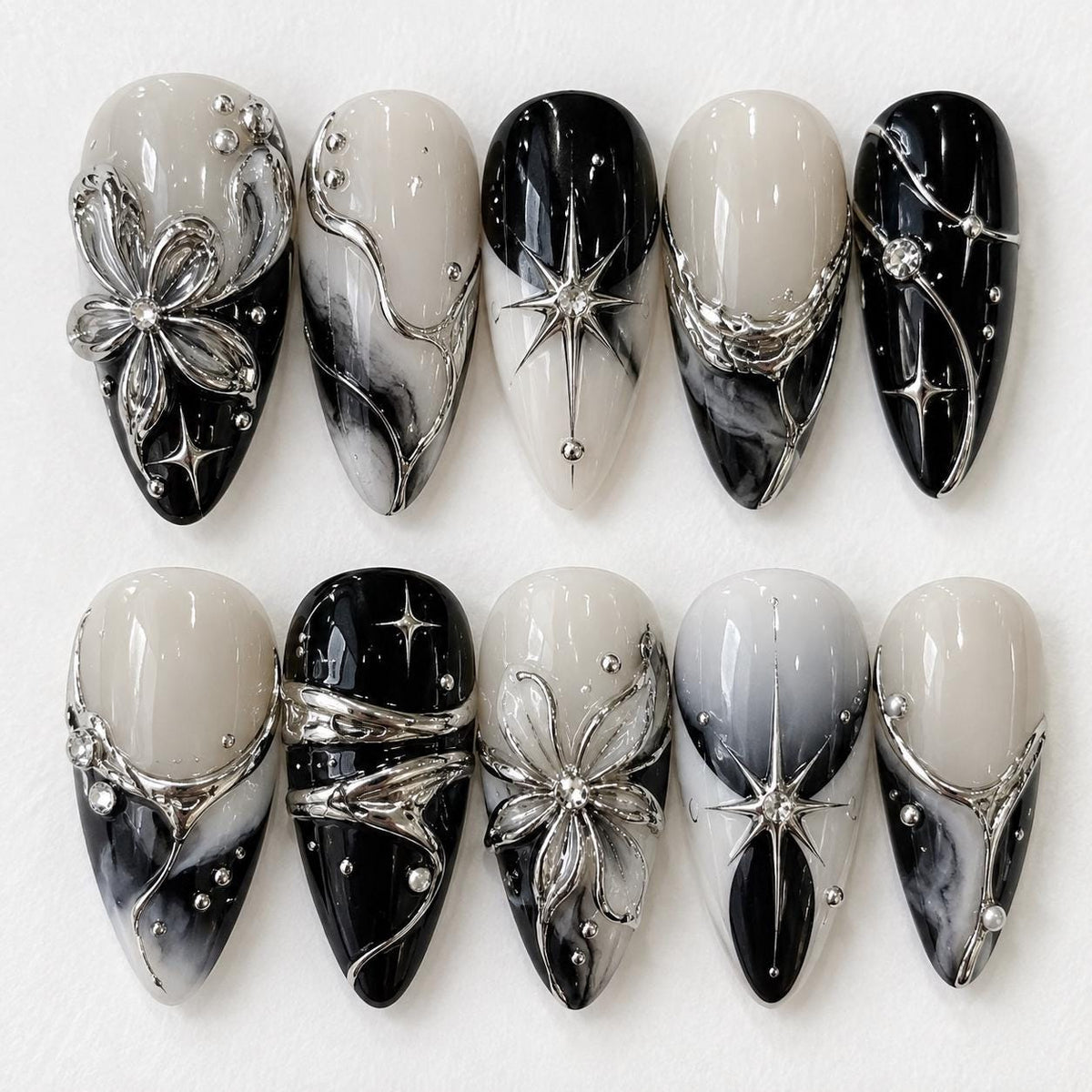 Gothic Black, Ivory, and Gray Marble Nails with Silver Flowers, Stars, and Rhinestones