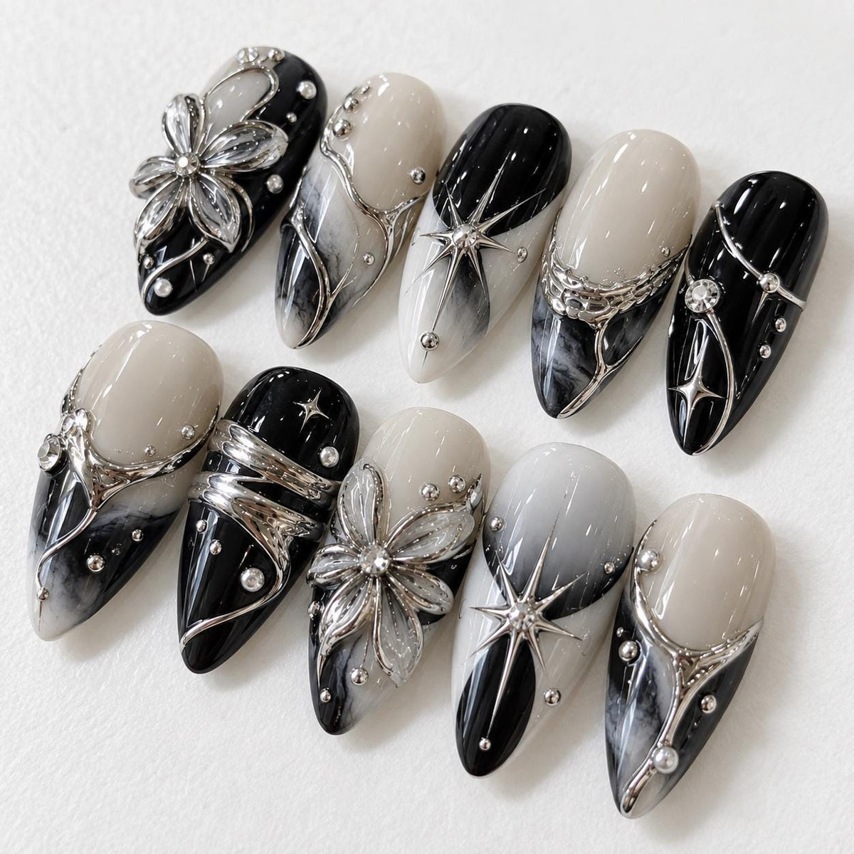 Gothic Black, Ivory, and Gray Marble Nails with Silver Flowers, Stars, and Rhinestones