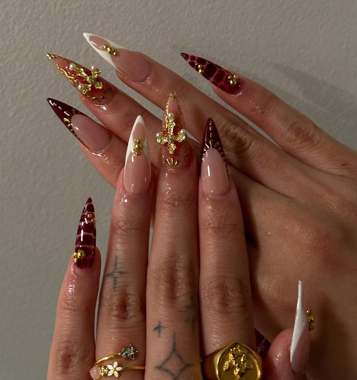 Gothic Burgundy and Nude Nails with Gold Cross and Rhinestone Details