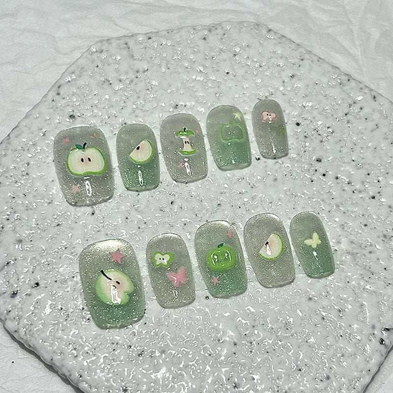 Green Cat-Eye Glitter Nail Set With Apple, Butterfly, and Star Details
