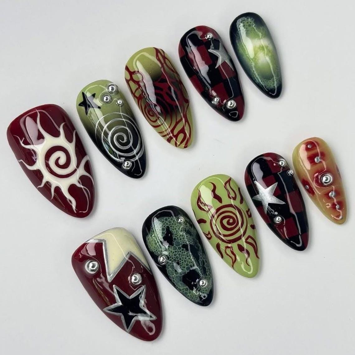 Grunge Sun Press On Nails With Red and Green Spirals, Stars and Checkerboard Details