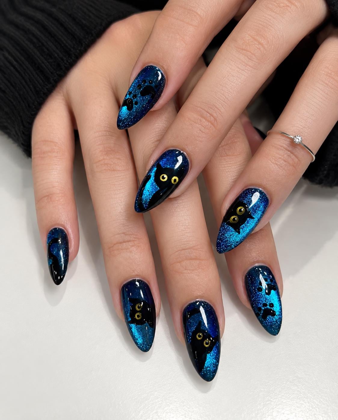 Halloween Blue Cat Eye Nails With Black Cats, Gold Eyes, and Paw Prints