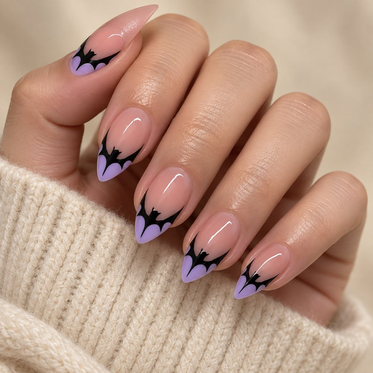 Halloween Purple Bat French Tip Press On Nails with Sheer Blush Pink Base worn on hand