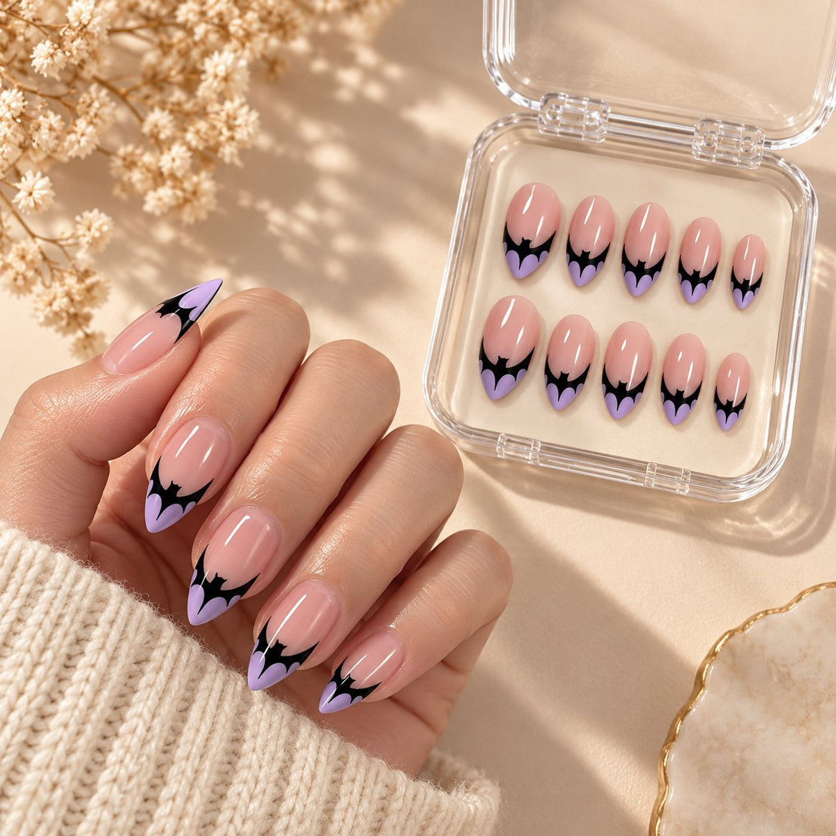 Halloween Purple Bat French Tip Press On Nails with Sheer Blush Pink Base worn on hand with acrylic storage box