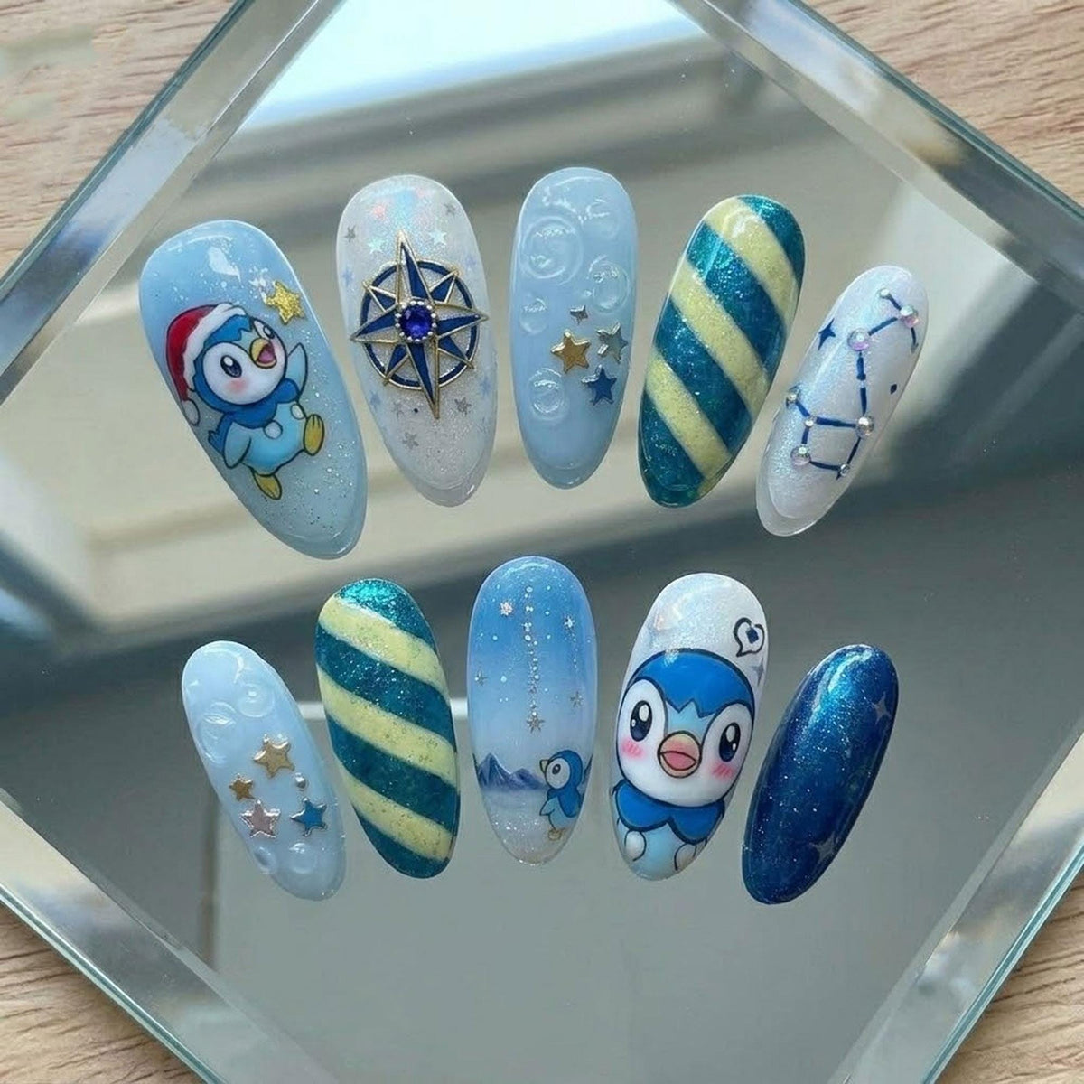 Icy Blue Christmas Penguin Nails With Snowflakes, Stars and Glitter