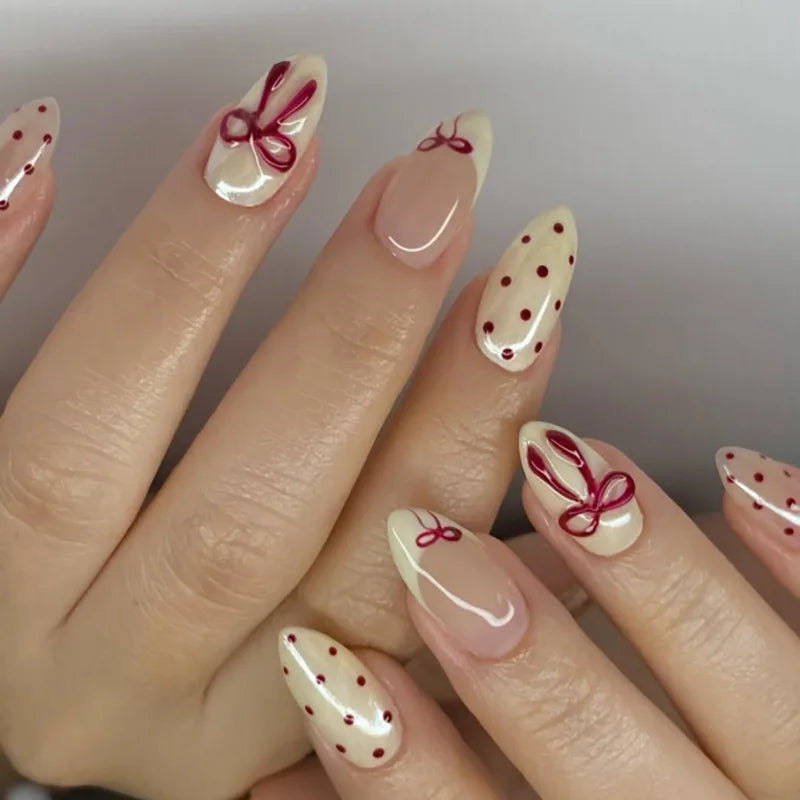 Ivory and Nude Pink Nails with Burgundy Bows and Polka Dots
