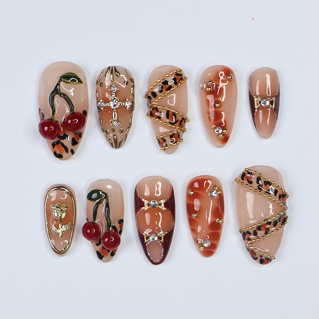 Leopard Print Cherry Nails with Gold Details and 3D Red Cherry Embellishments
