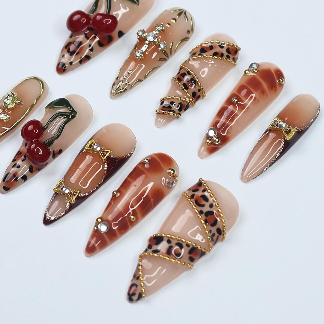 Leopard Print Cherry Nails with Gold Details and 3D Red Cherry Embellishments
