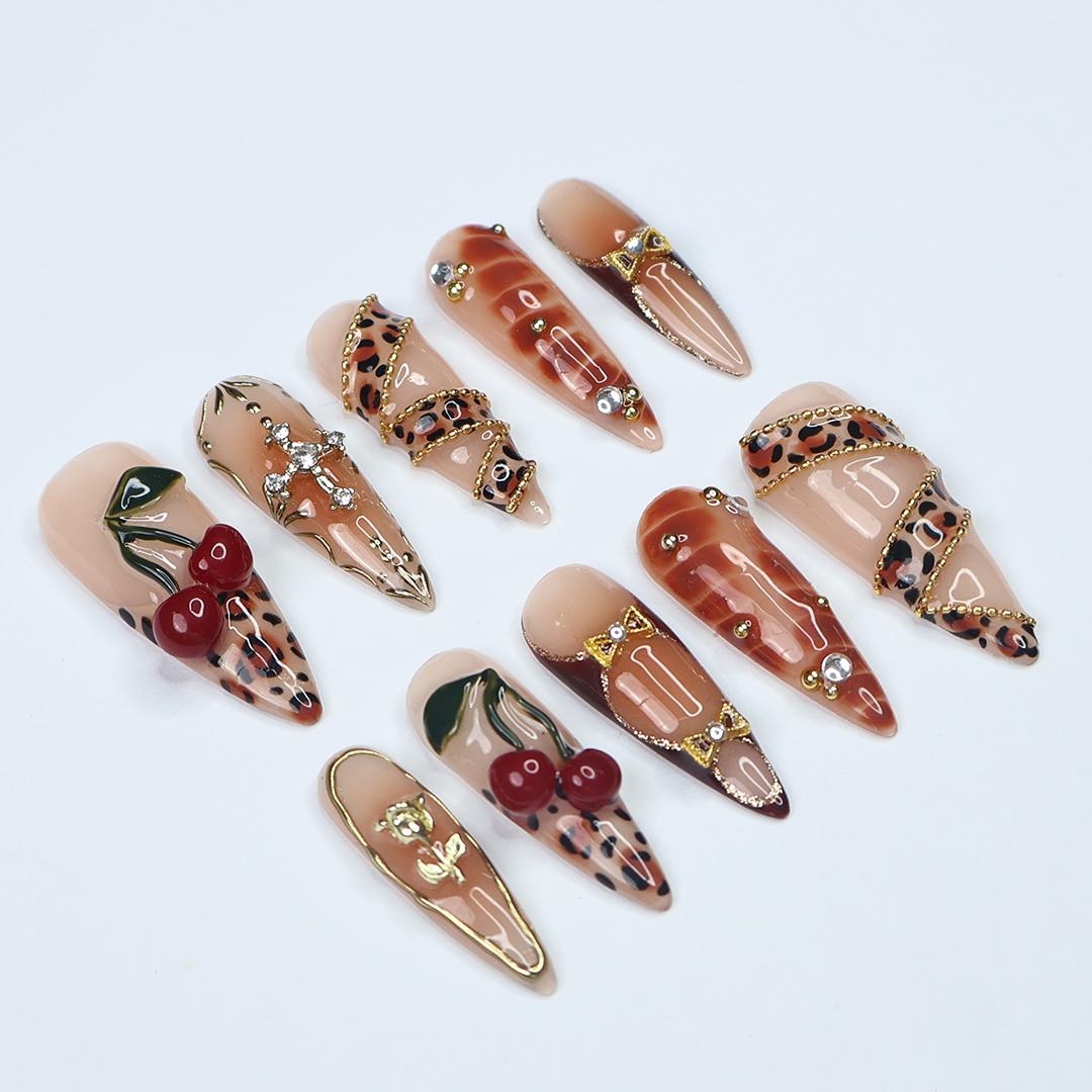 Leopard Print Cherry Nails with Gold Details and 3D Red Cherry Embellishments
