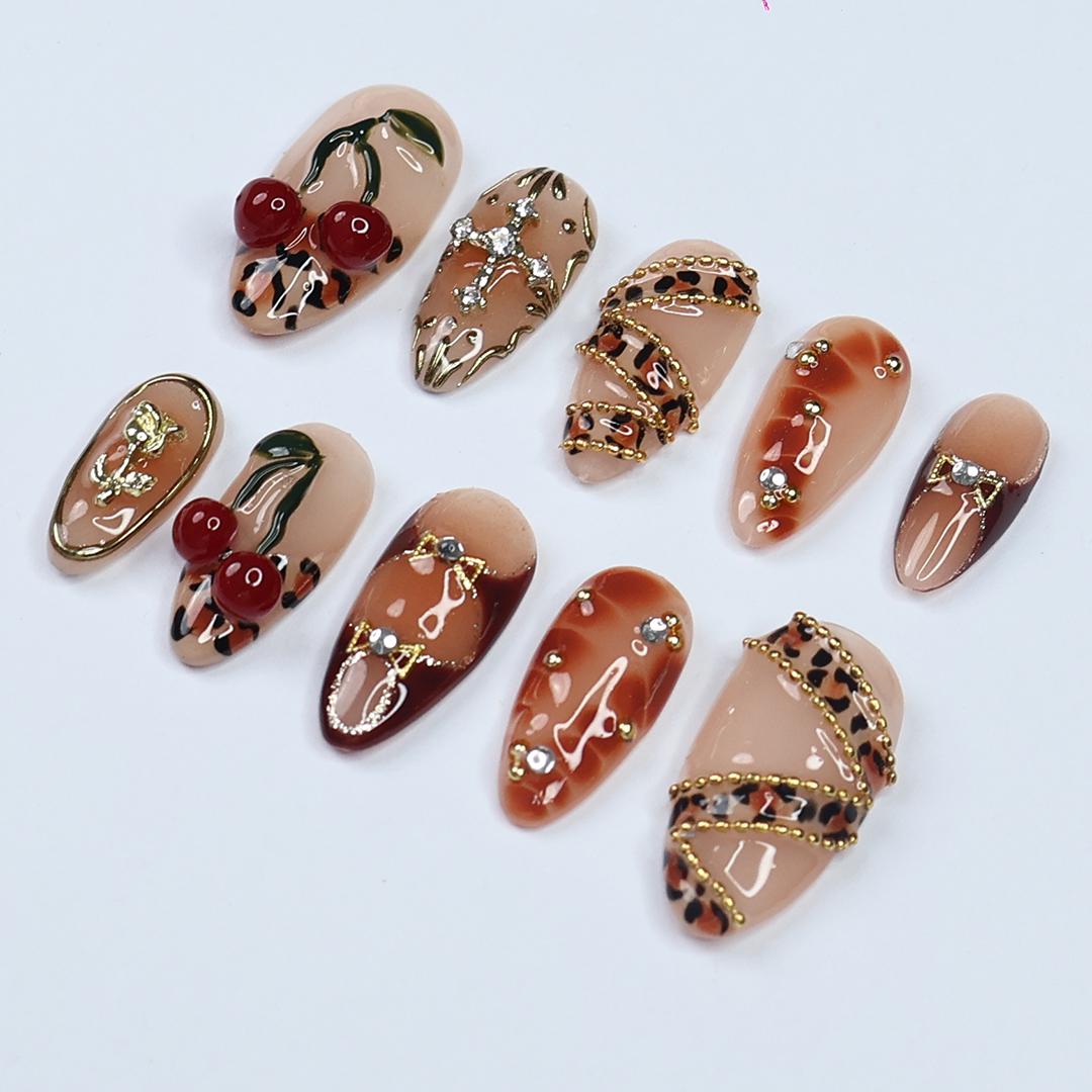 Leopard Print Cherry Nails with Gold Details and 3D Red Cherry Embellishments