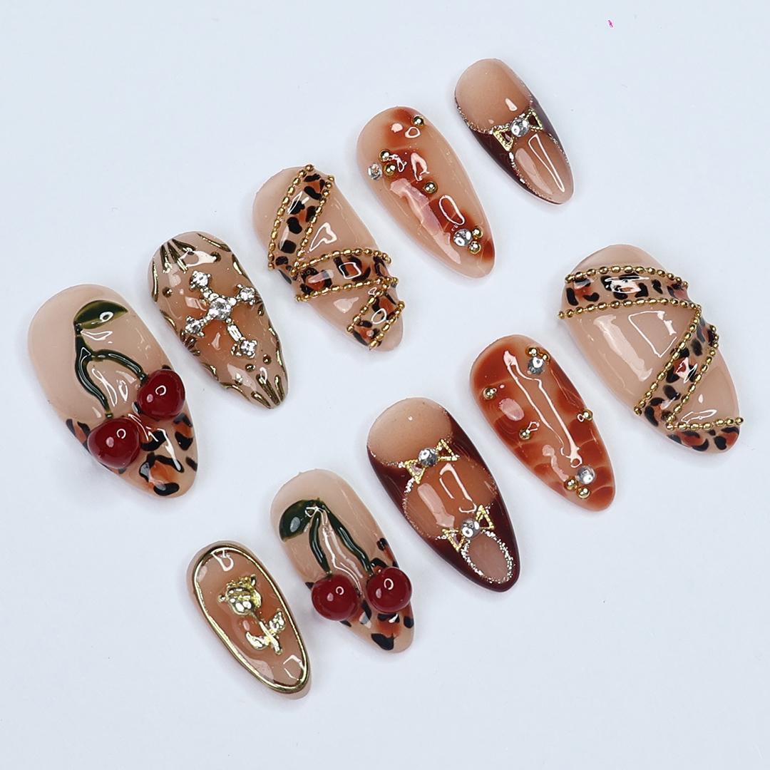 Leopard Print Cherry Nails with Gold Details and 3D Red Cherry Embellishments