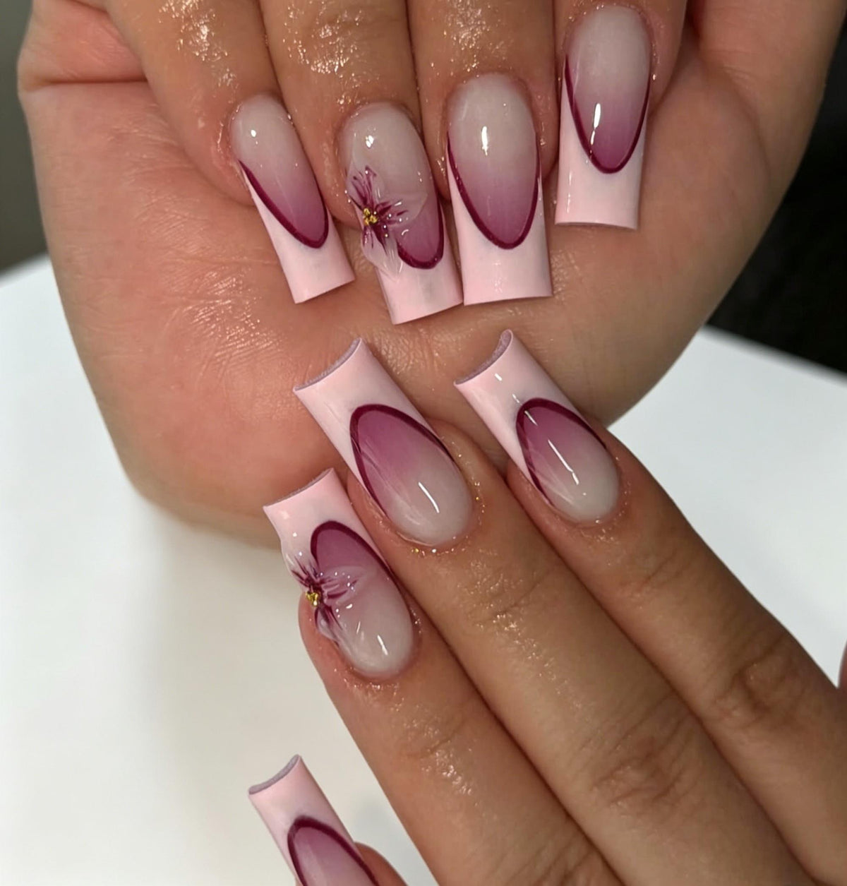 Magenta Curved French Line Nails With Pink and Gold Floral Accents